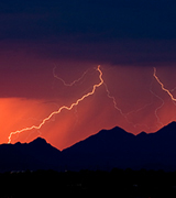 Rain and lightning at sunset.